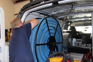 Home Restoration Technician Prepping Suction Hoses