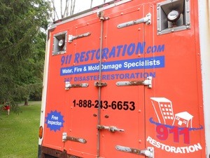 Water Damage Restoration Box Truck Rear At Residential Job Location