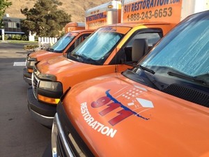 Water Damage Restoration Vans Parked