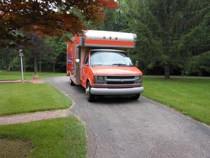 Water Damage Restoration Box Truck Driving To Residential Job Site