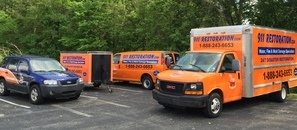 Water Damage and Mold Removal Trucks Getting Ready For Remediation Job